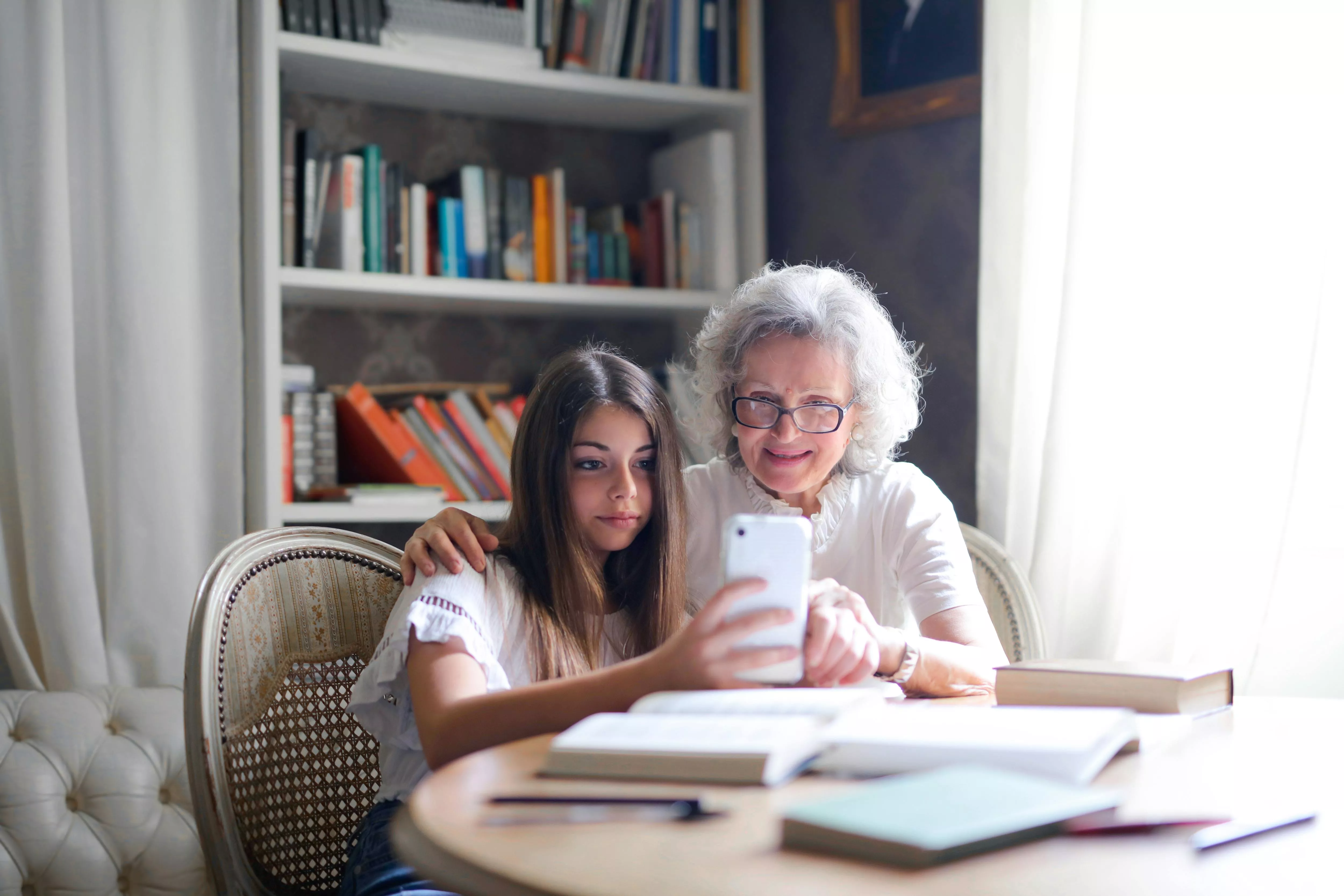 elder and child with phone